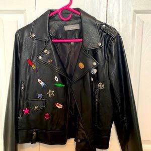 Black moto jacket with fun appliqués.